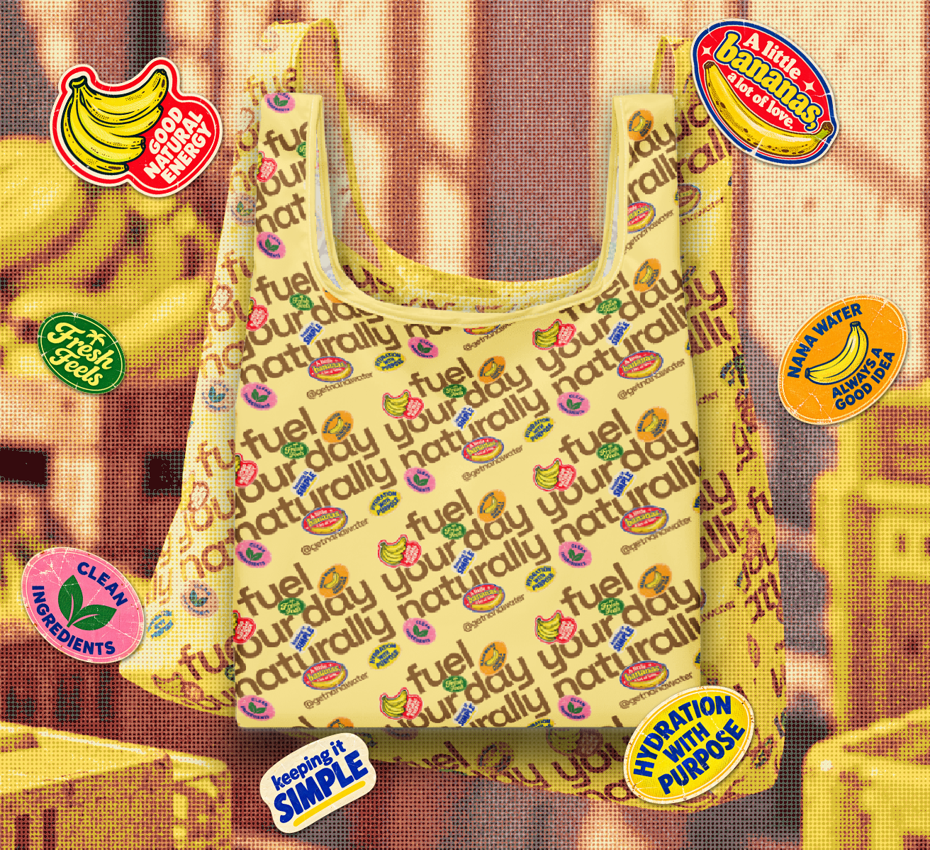 Front of the yellow NANA Water grocery bag with all-over slogan and fruit sticker print