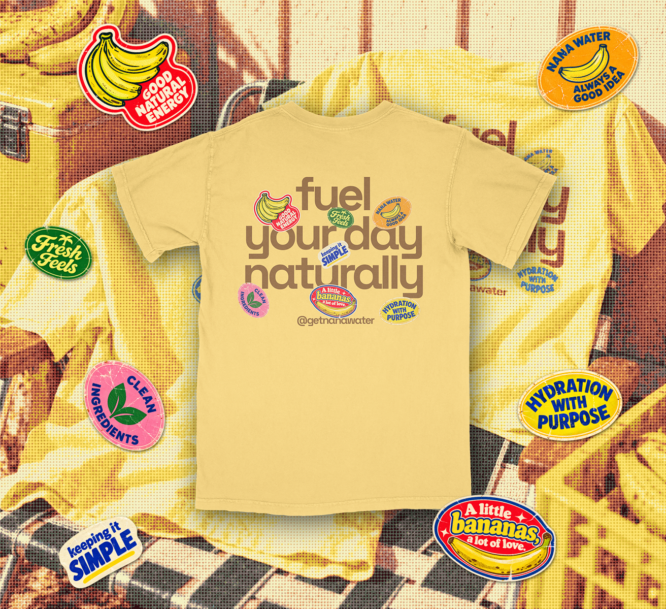 Back of the yellow NANA Water shirt with Fuel your day naturally lettering and fruit stickers